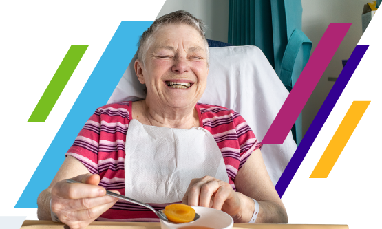 NHS healthcare professional holding a tablet device in a hospital setting