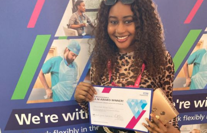 Jennifer Ejro Inoni from Royal Berkshire NHS Foundation Trust holding their GEM Awards prize.